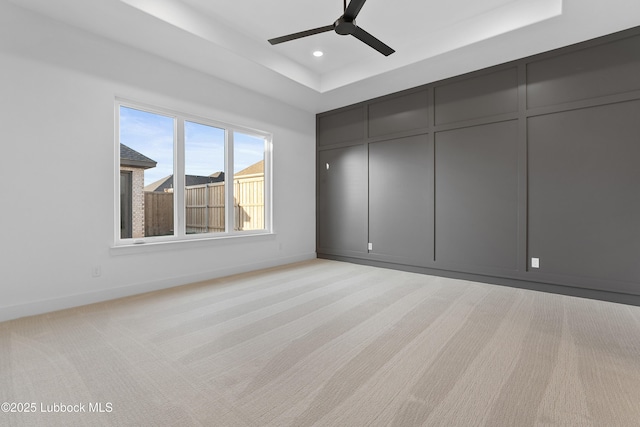 4806 139th St, Lubbock, TX 79424 - unfurnished bedroom with a tray ceiling, a decorative wall, a ceiling fan, baseboards, and recessed lighting