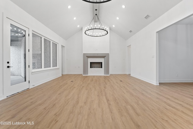4806 139th St, Lubbock, TX 79424 - unfurnished living room featuring a chandelier, high vaulted ceiling, light wood-type flooring, recessed lighting, and baseboards
