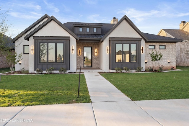 4806 139th St, Lubbock, TX 79424 - modern inspired farmhouse featuring board and batten siding, a front yard, and brick siding