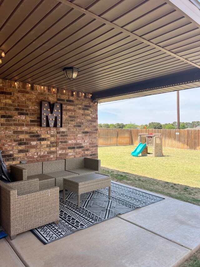 7022 34th Pl, Lubbock, TX 79407 - view of patio / terrace featuring an outdoor hangout area and a playground