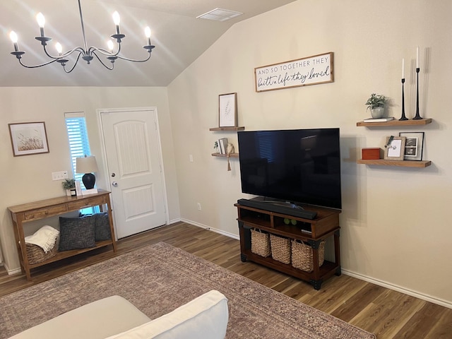 7022 34th Pl, Lubbock, TX 79407 - living area featuring wood finished floors, a chandelier, lofted ceiling, and baseboards