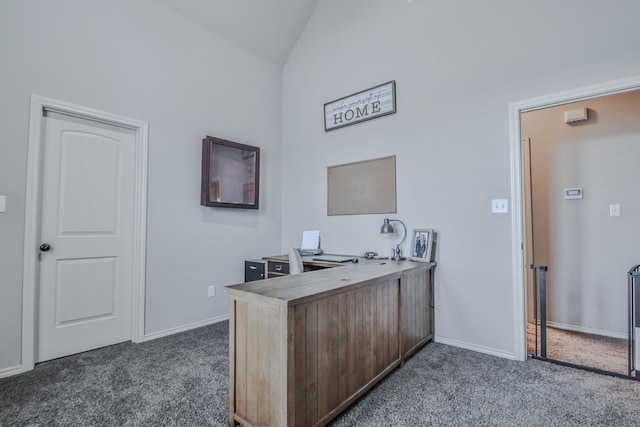 office featuring lofted ceiling and dark carpet