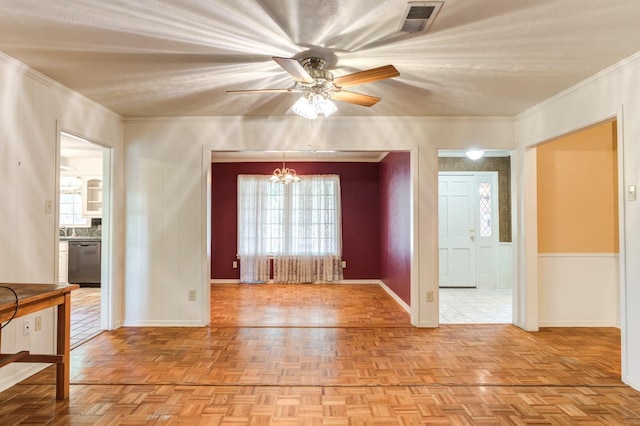 interior space with light parquet flooring, ornamental molding, and an inviting chandelier