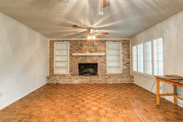 unfurnished living room with built in shelves, ceiling fan, crown molding, and a textured ceiling