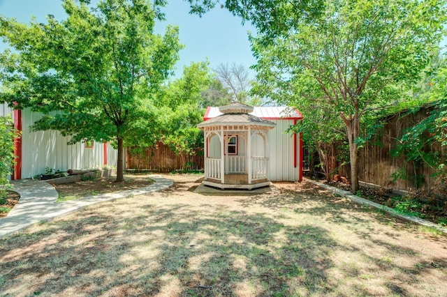 view of yard with a gazebo and an outdoor structure