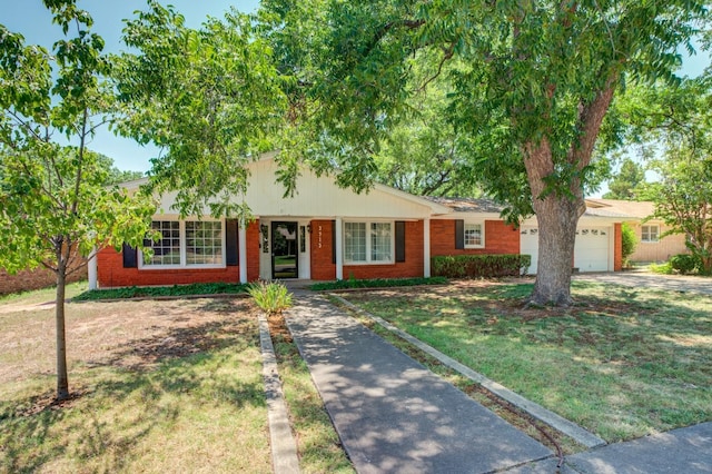 single story home featuring a garage and a front yard