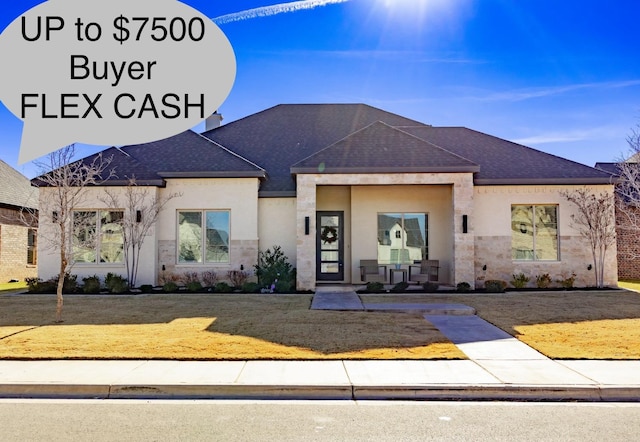 view of front of property with a front lawn