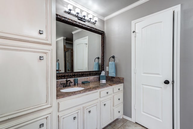 bathroom featuring ornamental molding, tile patterned flooring, and vanity