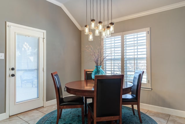 tiled dining area with ornamental molding, vaulted ceiling, and an inviting chandelier