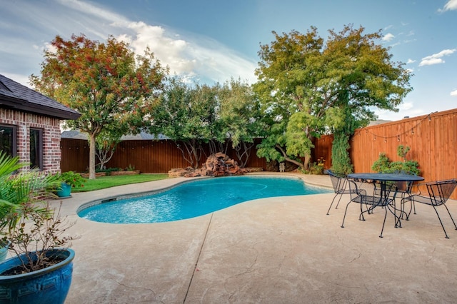 view of swimming pool featuring a patio