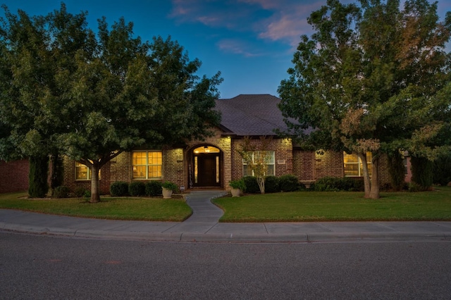 view of front of property with a yard