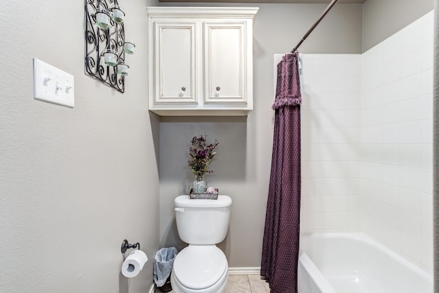 bathroom featuring tile patterned floors, shower / bath combination with curtain, and toilet