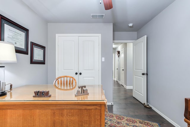 office featuring dark wood-type flooring and ceiling fan