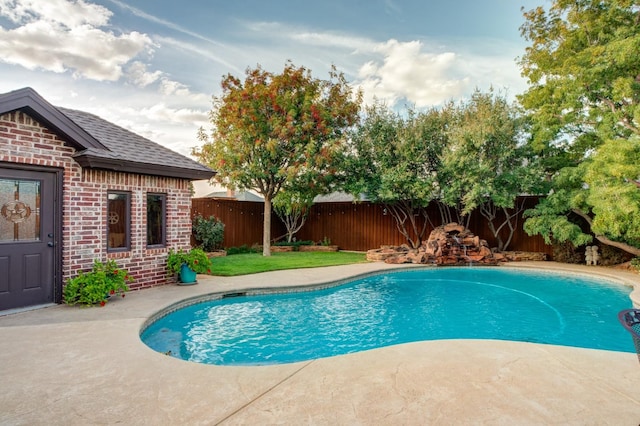 view of swimming pool with a patio area