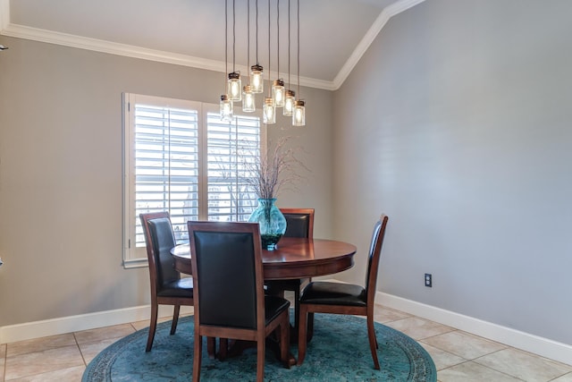 dining room with crown molding and light tile patterned flooring