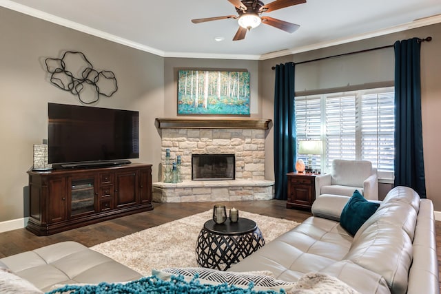 living room with crown molding, a fireplace, dark hardwood / wood-style floors, and ceiling fan