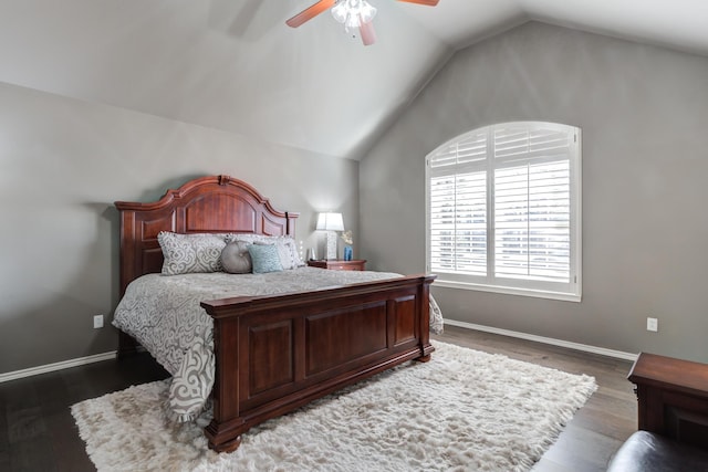 bedroom featuring dark wood-type flooring, ceiling fan, and vaulted ceiling