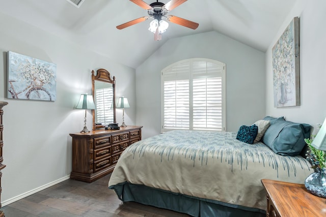 bedroom with ceiling fan, wood-type flooring, and vaulted ceiling