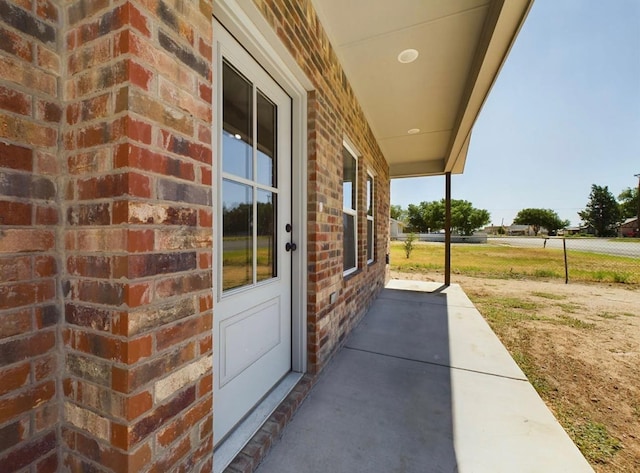 property entrance featuring a patio