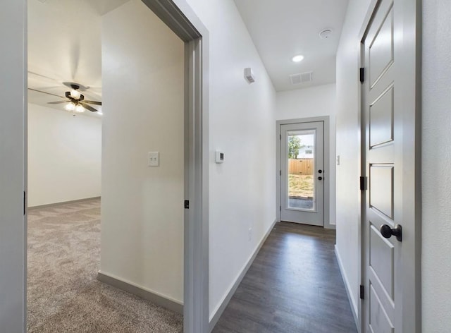 hall with dark carpet