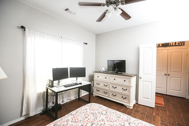 bedroom with dark wood-type flooring and ceiling fan