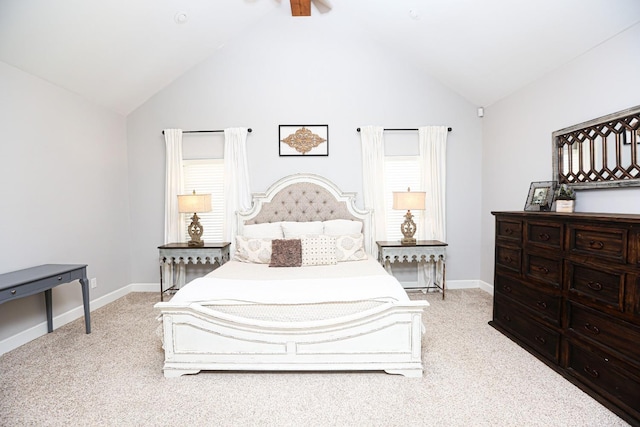 carpeted bedroom featuring ceiling fan and high vaulted ceiling