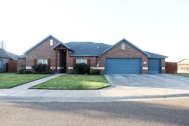 single story home featuring a garage and a front yard