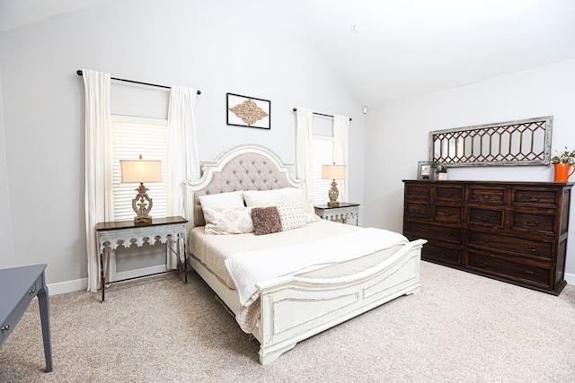 bedroom featuring carpet floors and high vaulted ceiling