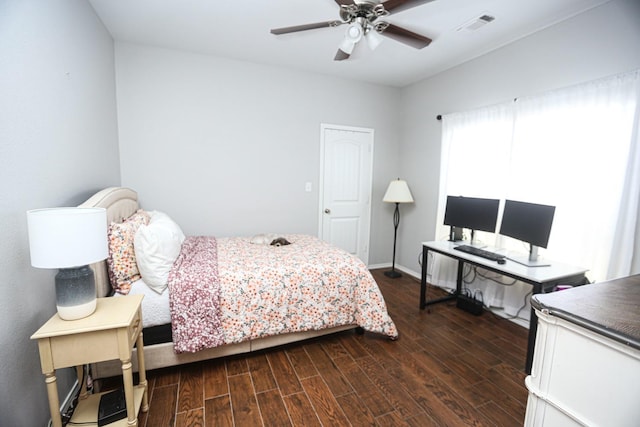 bedroom with dark wood-type flooring and ceiling fan