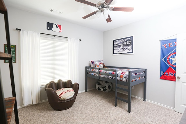 bedroom with ceiling fan and light colored carpet