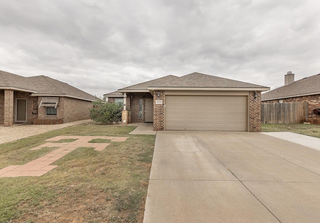 view of front facade with a garage and a front lawn