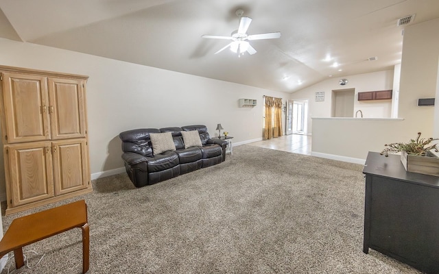 carpeted living room with lofted ceiling and ceiling fan