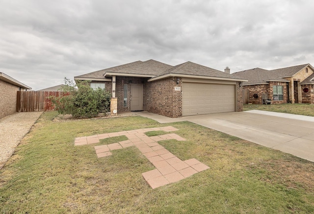 view of front of home featuring a garage and a front lawn