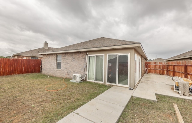 back of house featuring a yard, a patio, and ac unit