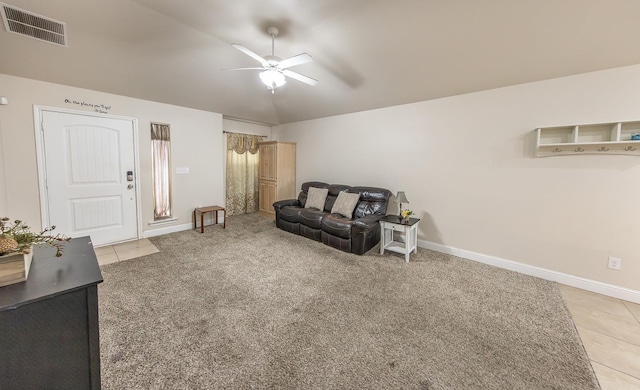 tiled living room with ceiling fan