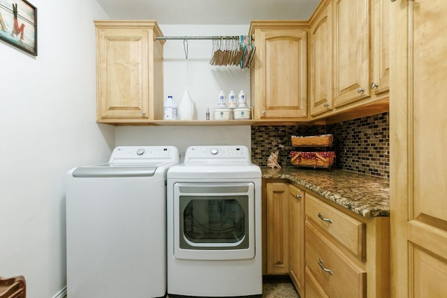 washroom with cabinet space and independent washer and dryer