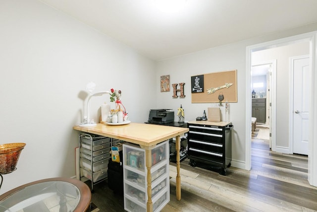 office space featuring wood finished floors and baseboards