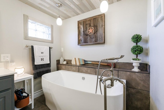 full bath featuring vanity, tile patterned floors, wooden ceiling, and a freestanding bath