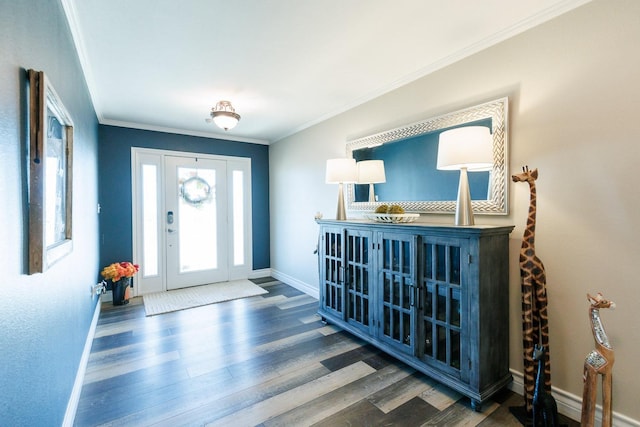 entryway featuring wood finished floors, baseboards, and ornamental molding