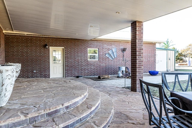 view of patio featuring outdoor dining area