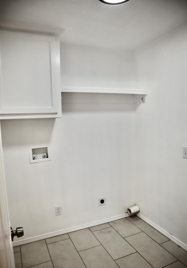 washroom with hookup for an electric dryer, hookup for a washing machine, and light tile patterned floors