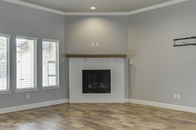 4020 125th St, Lubbock, TX 79423 - unfurnished living room featuring wood finished floors, crown molding, recessed lighting, and a fireplace