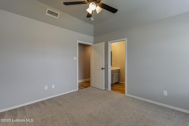 4020 125th St, Lubbock, TX 79423 - unfurnished bedroom featuring carpet flooring, connected bathroom, and ceiling fan