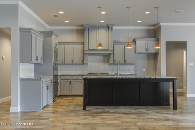 4020 125th St, Lubbock, TX 79423 - kitchen featuring gray cabinetry, light stone countertops, backsplash, ornamental molding, and light wood-type flooring