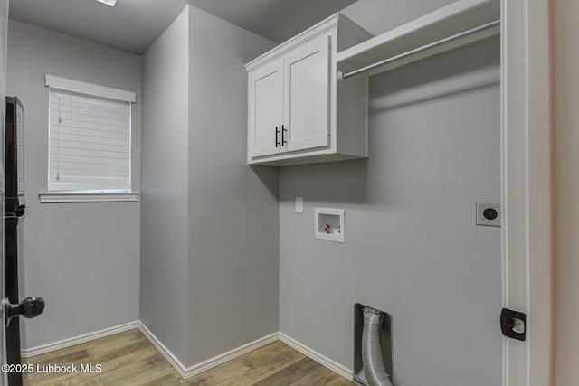 4020 125th St, Lubbock, TX 79423 - laundry room with hookup for an electric dryer, light wood-style floors, cabinet space, and washer hookup