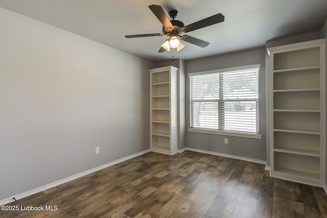 4020 125th St, Lubbock, TX 79423 - spare room featuring dark wood-type flooring and a ceiling fan
