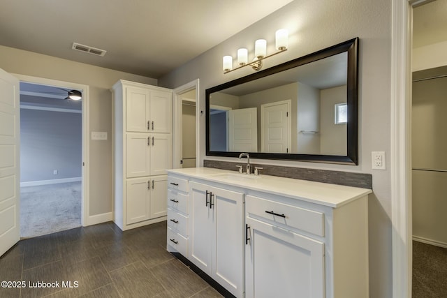 4020 125th St, Lubbock, TX 79423 - bathroom with vanity and baseboards