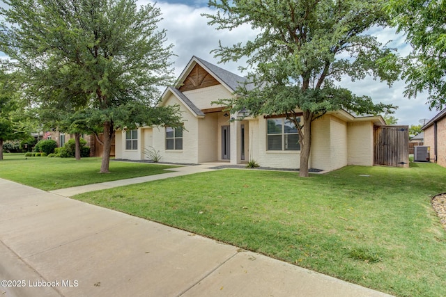 4020 125th St, Lubbock, TX 79423 - view of front of home featuring brick siding and a front lawn