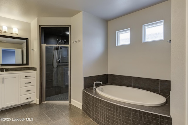 4020 125th St, Lubbock, TX 79423 - full bath with vanity, a garden tub, and a shower stall