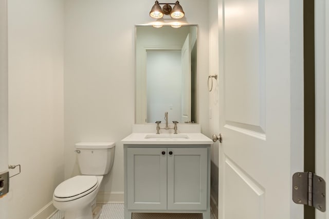 bathroom with tile patterned floors, vanity, and toilet